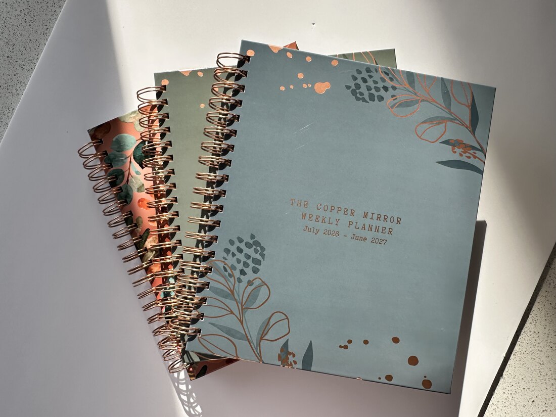 The Copper Mirror Weekly Planner — Warm Azure cover