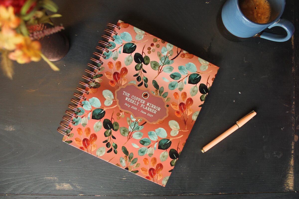 Terracotta cover styled on a dark table