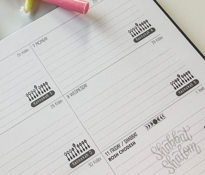 Open weekly spread with Hannukah and Shabbat marked, ready for planning