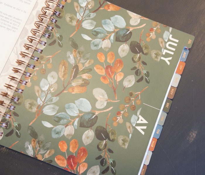 Printed month tab dividers with the Av / July floral divider page